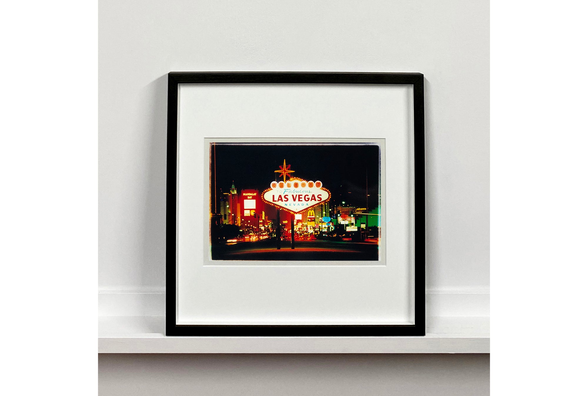 Taken upon arriving in Las Vegas, and featured in Richard Heeps' 'Dream in Colour' series, this piece features a classic American neon sign, with the famous Vegas landscape in the background. 