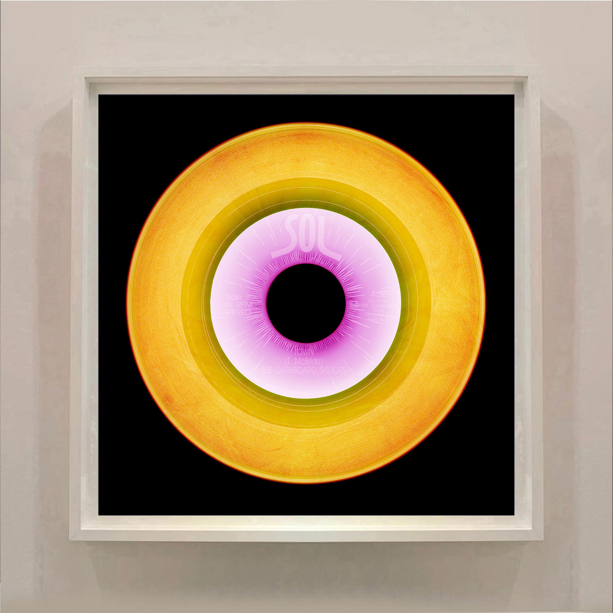Bright gold yellow pop art from the Heidler and Heeps vinyl collection framed in white.