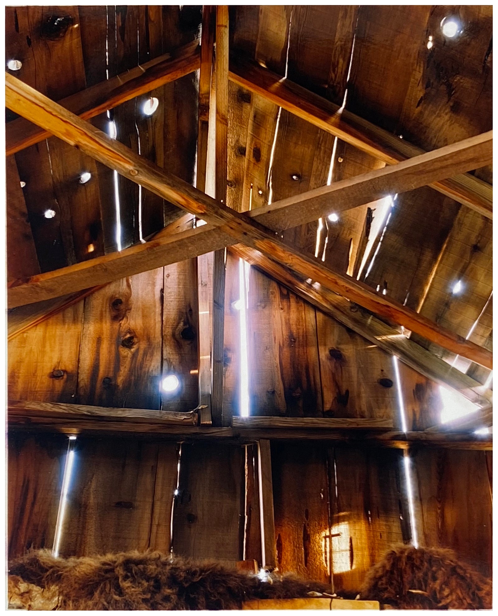 Light breaks through the cracks in the barn on the movie set of Clint Eastwood's Western film 'The Outlaw Josey Wales'. Captured in Kanab, Utah, which was the setting of many Western movies. Photographed by Richard Heeps for his 'Dream in Colour' series.