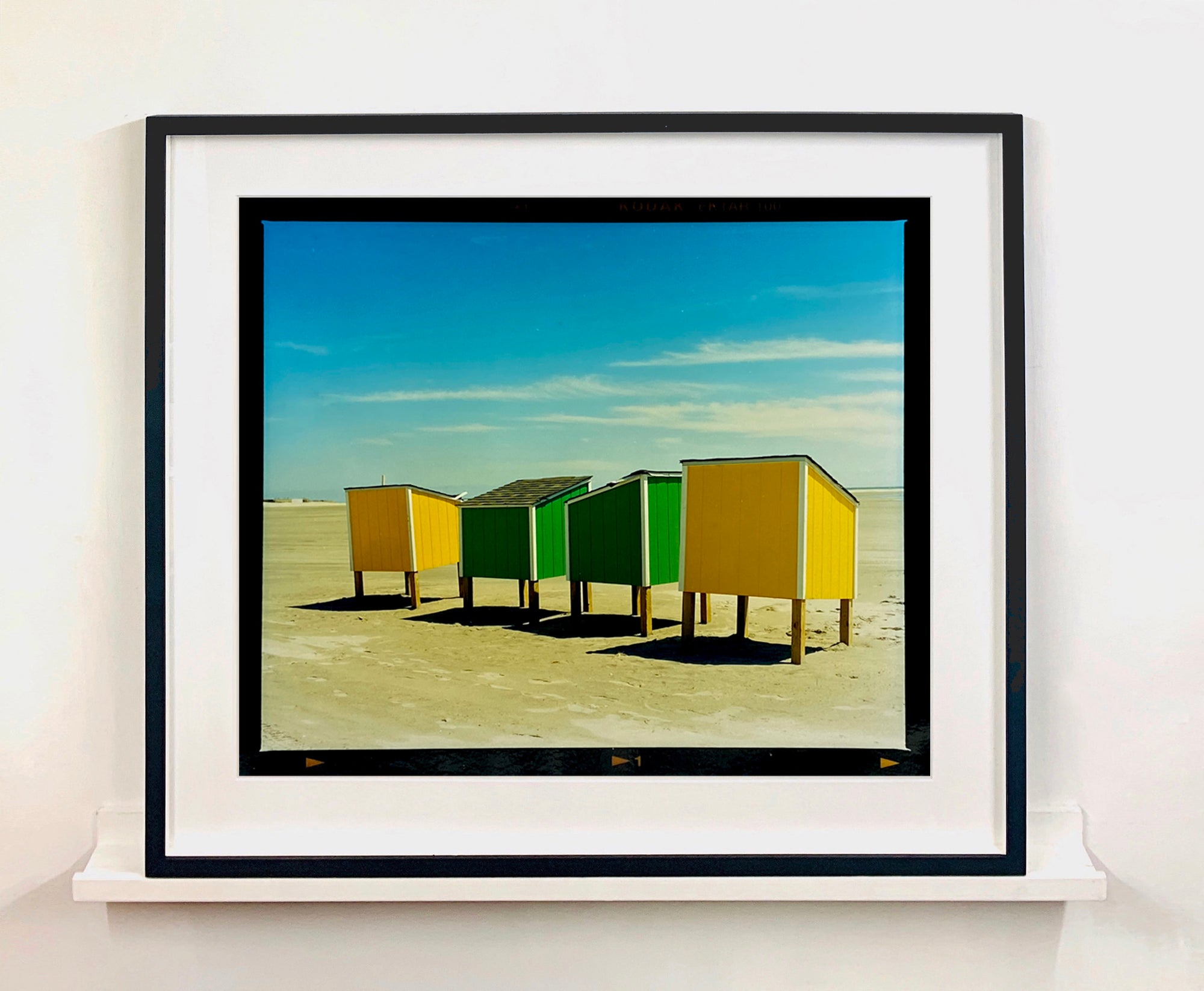 'Beach Lockers' was captured on a glorious spring day in Wildwood, New Jersey. It features bold yellow and green shapes against a beach and bright blue sky. Taken in 2013, this photograph was first executed in Richard's darkroom in April 2020. Colour is key in Richard's work, and through the simplicity of this artwork, it really shows. Whilst photographing on the East Coast of America, Richard drew parallels of familiarity to the East Coast of England.
