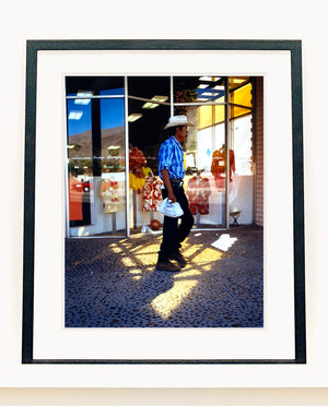 'Boutique' is street portrait, taken in Palm Springs, California. This piece is different from Richard Heeps' usual style, but everything fell into place: the light, the colours, and the man walking through the shot.