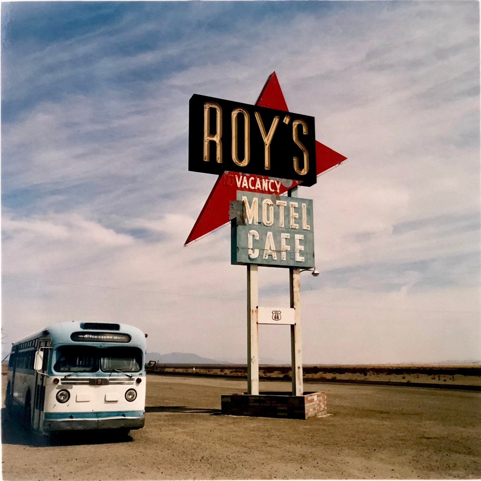 'Bus - Roy's Route 66', part of Richard Heeps 'Dream in Colour' series. This is one of Richard's classic American signs artworks, photographed at the iconic Roy's Motel on Route 66, Amboy, California, featuring the famous 1960's GM Bus.