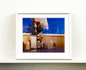 'Condiments' shows a classic American Diner table-scape, captured at the Bonanza Café in the small town of Lone Pine, California. This piece is part of Richard Heeps' 'Dream in Colour' series.