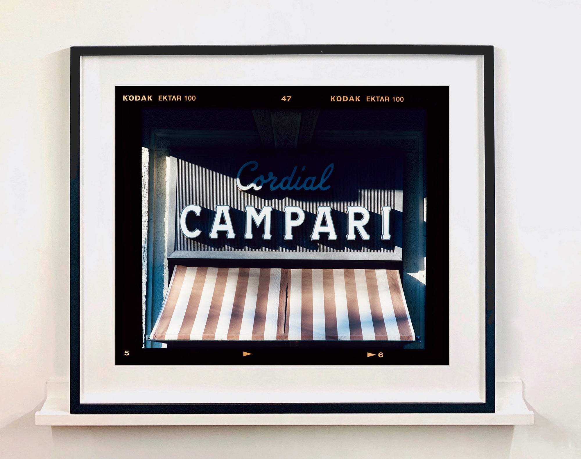 Cordial Campari, photographed as part of Richard Heeps’ series 'A Short History of Milan’ features typography above the striped awning of a fascist building. 