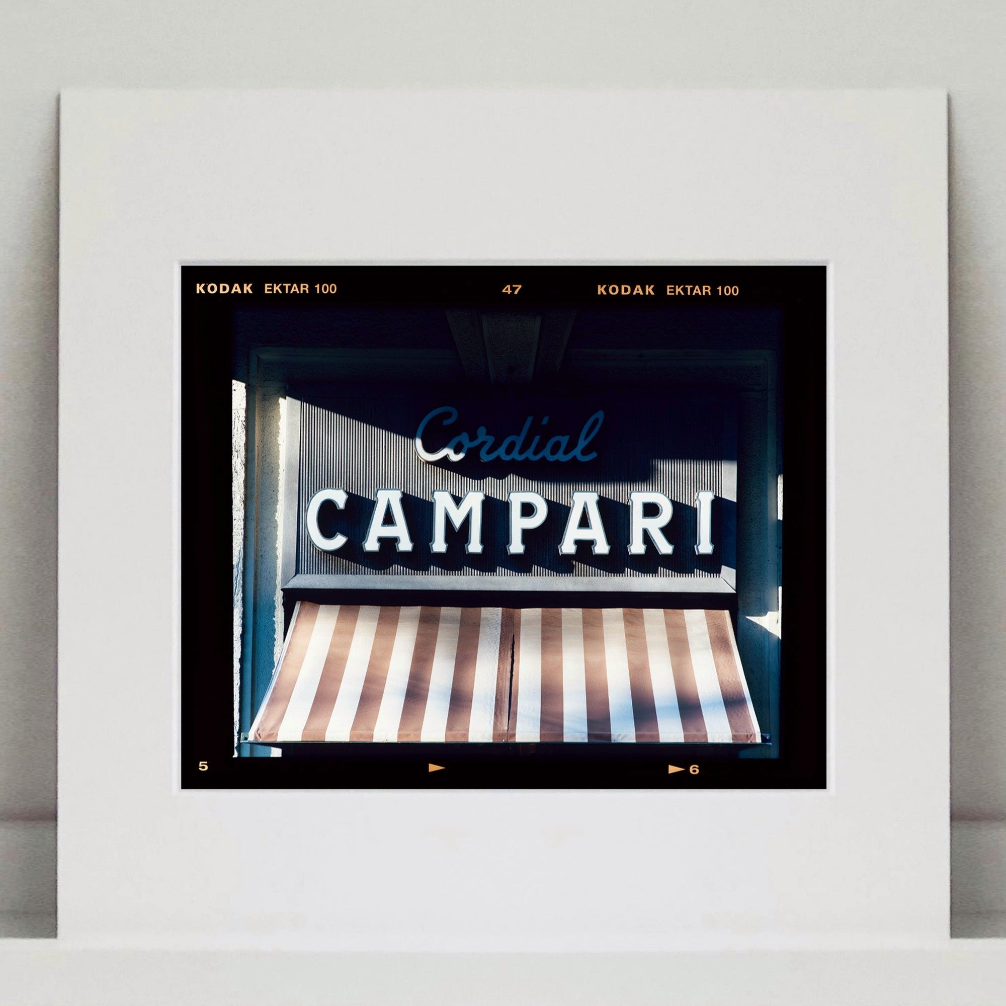 Cordial Campari, photographed as part of Richard Heeps’ series 'A Short History of Milan’ features typography above the striped awning of a fascist building. 