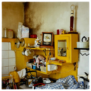 Photograph by Richard Heeps.  Yellow ramshackled vintage kitchen.