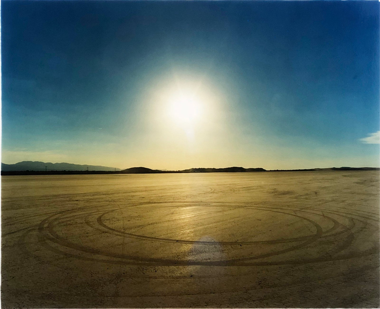 Photographed at El Mirage Lake, where the Southern Californian Timing Association, Land Speed Racing event, tracks in the ground from the previous days racing, adding a beauty to the natural landscape.