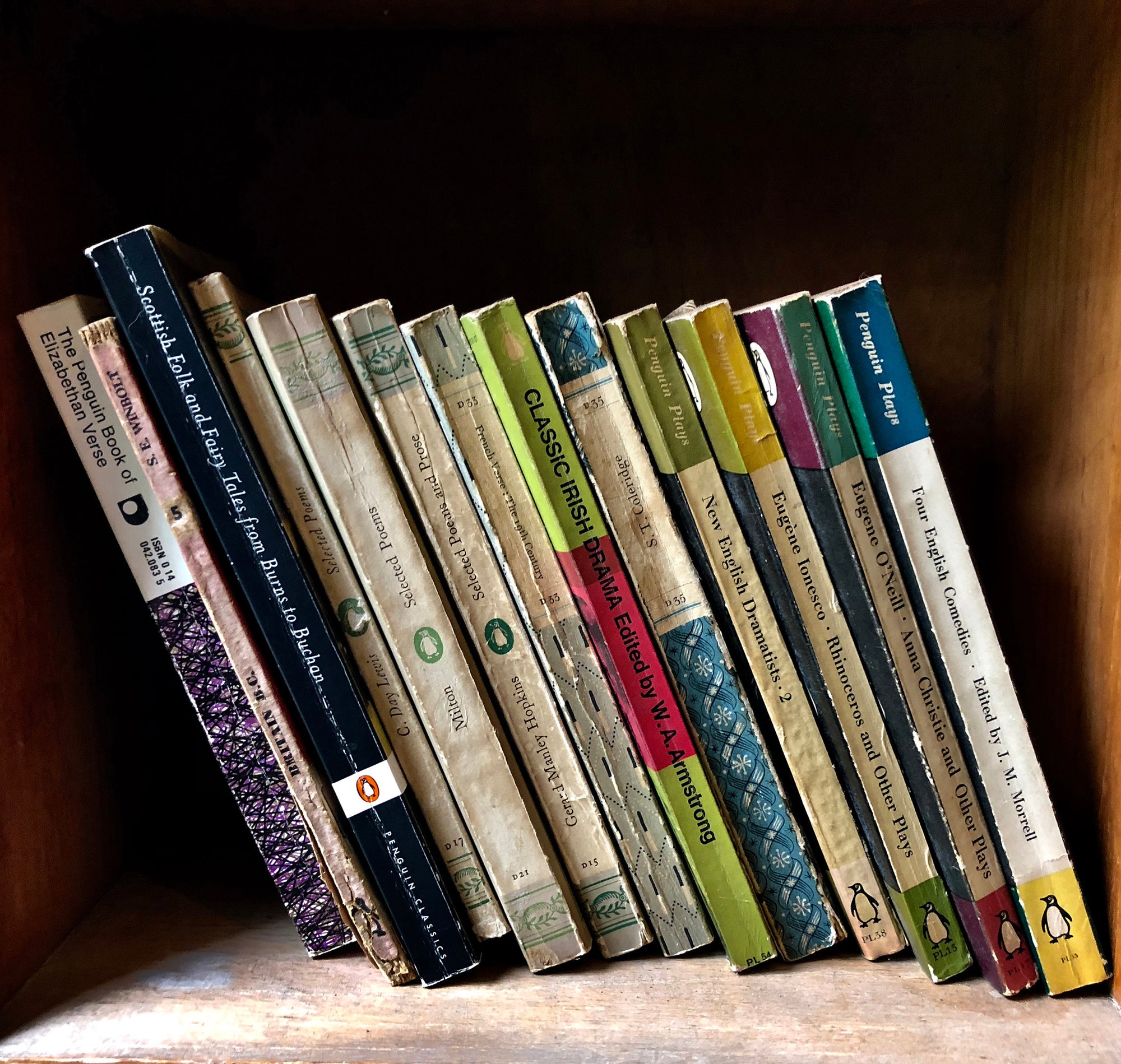 Folk and Fairy Tales, Wells-next-the-Sea shows the well worn spines of vintage books on a shelf, photographed by Richard Heeps in a secondhand bookshop in the British seaside town Wells-next-the-Sea.