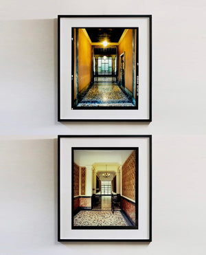 An Art Deco entrance hall in Milan, featuring stained glass panelling and marble flooring. 
