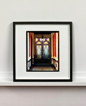 'Foyer VII' shows an Art Deco entrance hall in Milan, featuring stained glass panelling and marble flooring. This artwork is part of Richard Heeps' series 'A Short History of Milan', which began in November 2018 for a special project featuring at the Affordable Art Fair Milan 2019, and the series is ongoing. There is a reoccurring linear, structural theme throughout the series, capturing the Milanese use of materials in design such as glass, metal, wood and stone. 