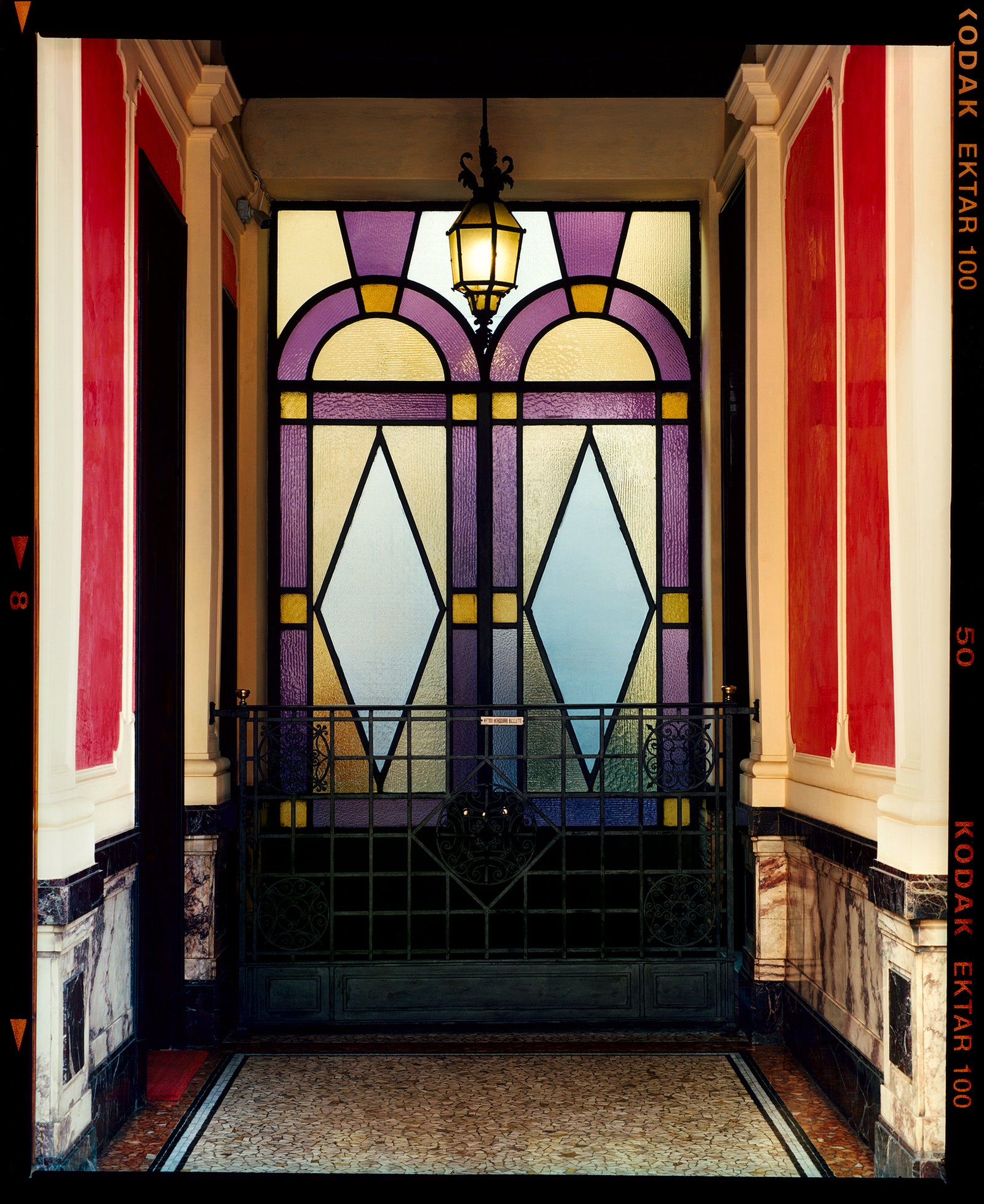 'Foyer VII' shows an Art Deco entrance hall in Milan, featuring stained glass panelling and marble flooring. This artwork is part of Richard Heeps' series 'A Short History of Milan', which began in November 2018 for a special project featuring at the Affordable Art Fair Milan 2019, and the series is ongoing. There is a reoccurring linear, structural theme throughout the series, capturing the Milanese use of materials in design such as glass, metal, wood and stone. 