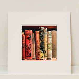 Mounted photograph of vintage book spines by Richard Heeps.