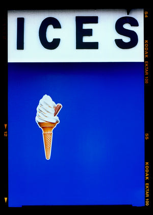 Photograph by Richard Heeps.  At the top black letters spell out ICES and below is depicted a 99 icecream cone sitting left of centre against a blue coloured background.  