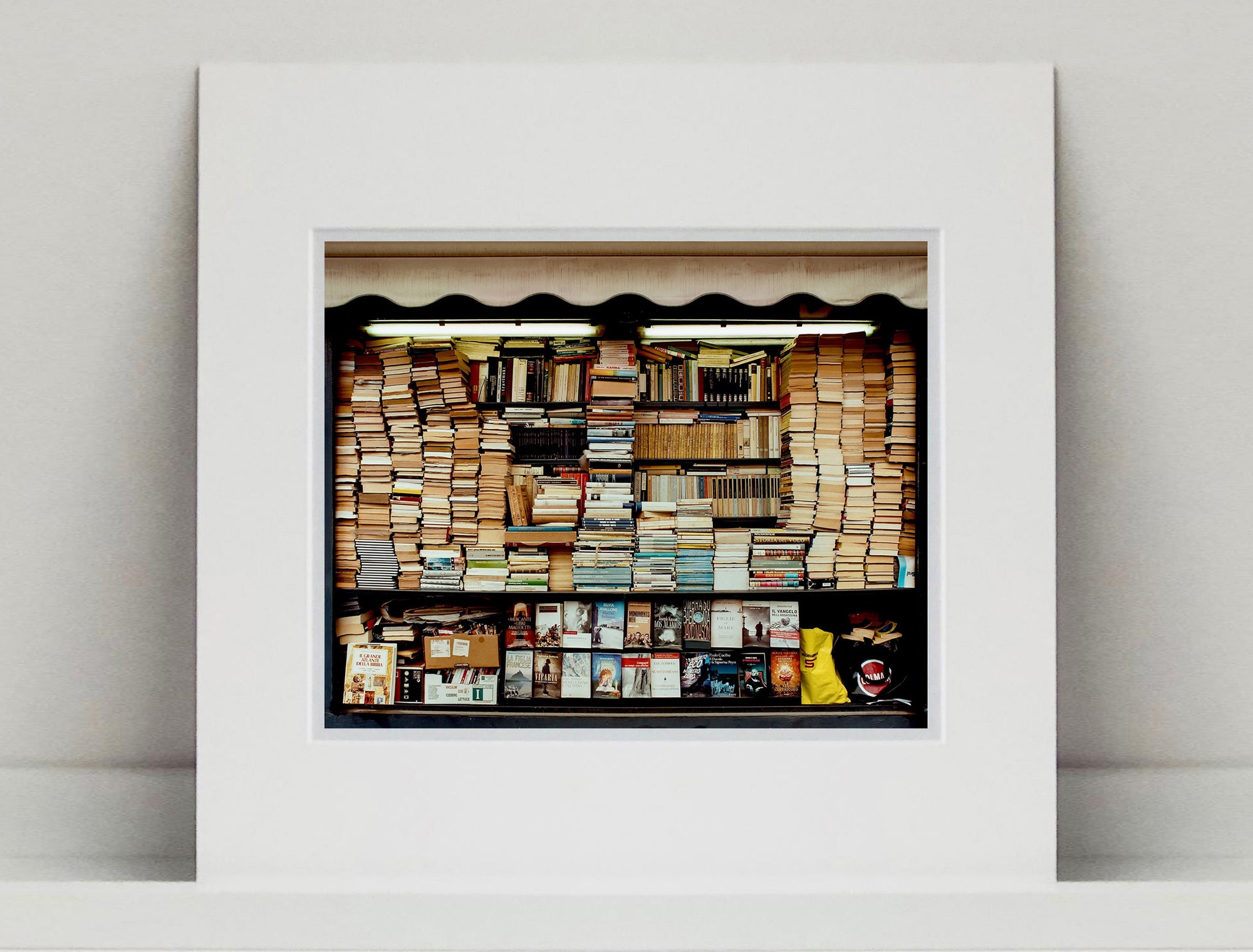 Books photographed under fluorescent lighting as part of Richard Heeps’ series A Short History of Milan.