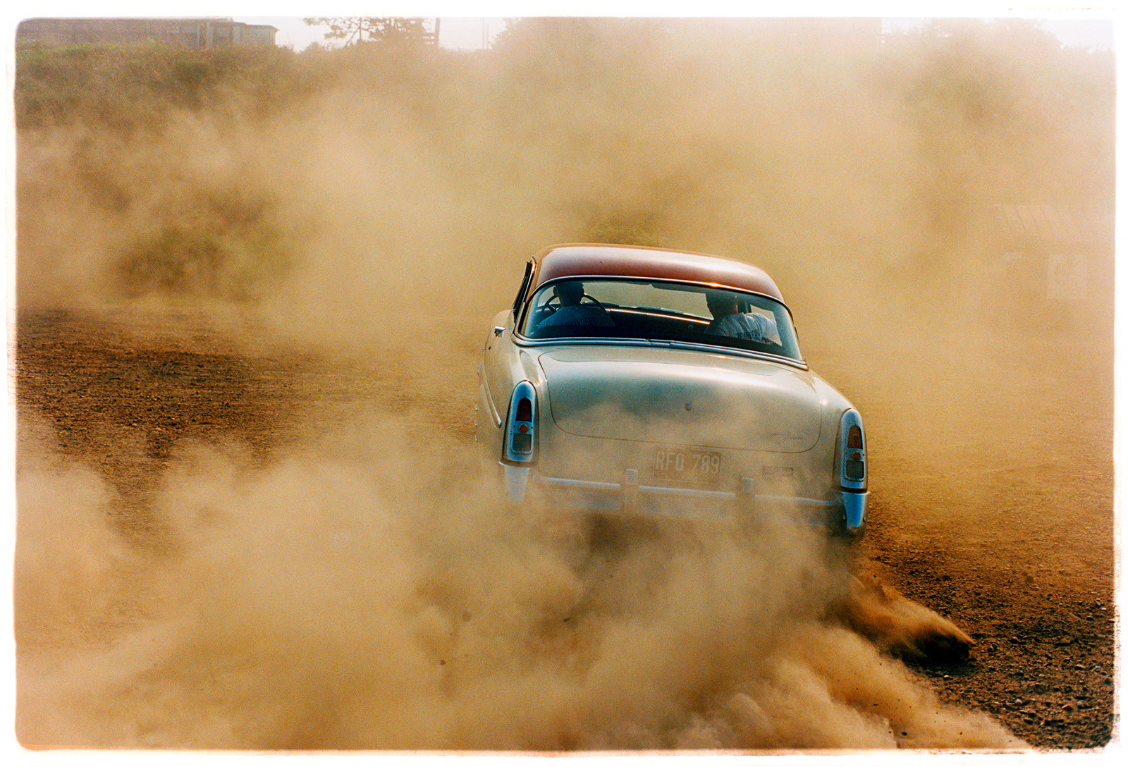 'Mercury in the Dust I' shows a classic American car donut driving on a Norfolk beach in the East of England. This photograph was captured at Hemsby Rock and Roll weekend, and is part of Richard Heeps' Man's Ruin' series.