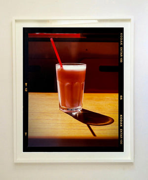 This enticing pink milkshake in a glistening glass was photographed by Richard Heeps in a Clacton-on-Sea cafe. The composition of this artwork is beautifully balanced by the angles of the red straw and shadow. 
