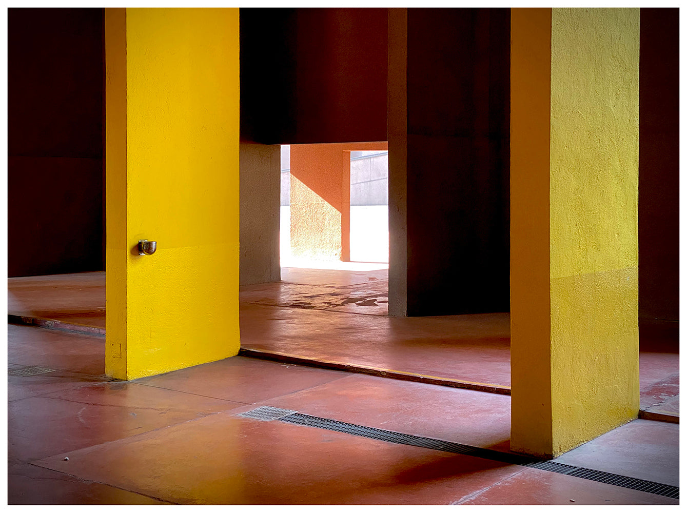 Yellow concrete interior brutalist Italian architecture photograph by Richard Heeps.