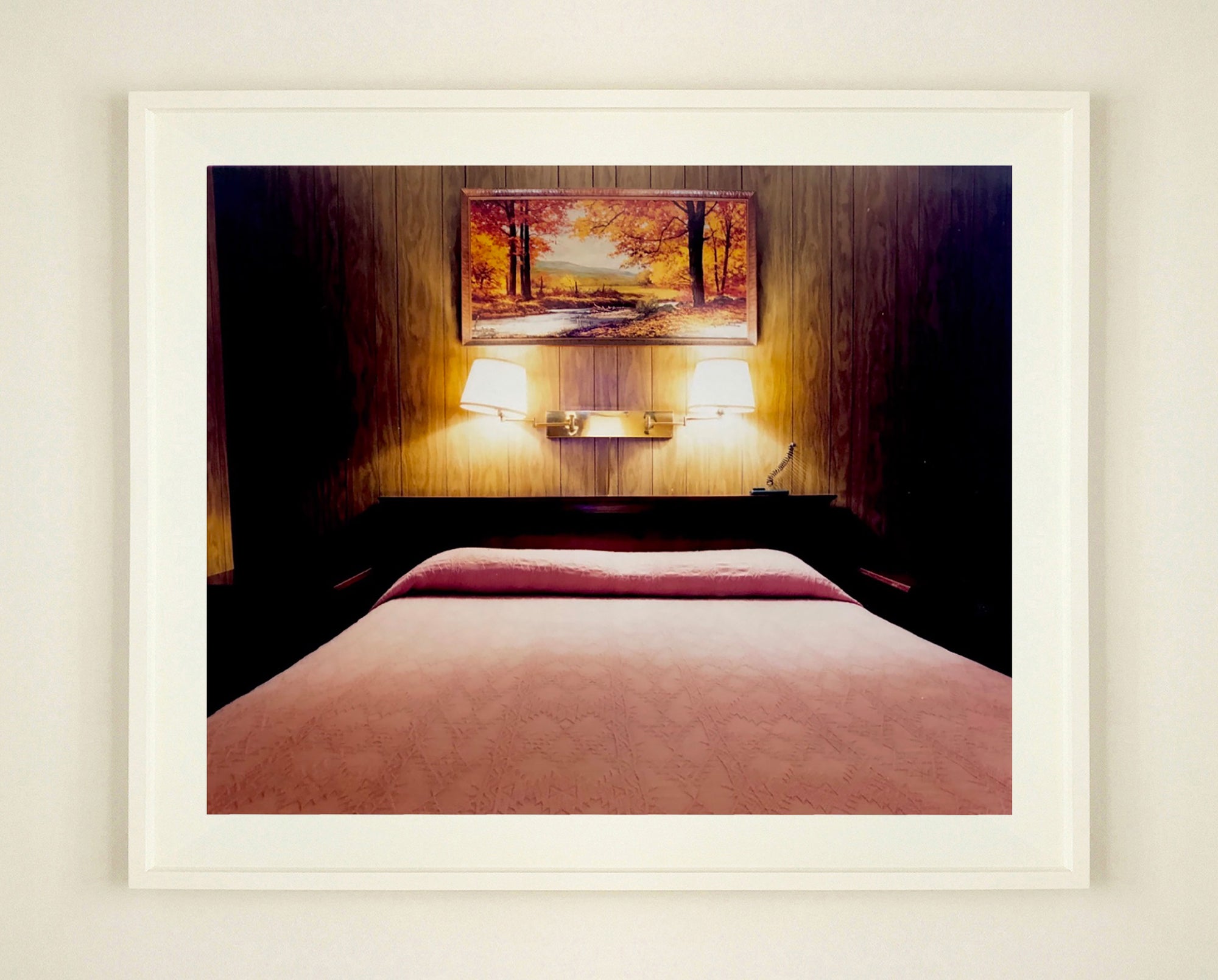 An ongoing subject of Richard's photography is the motel room. In this instance, photographed at the Lariat Motel in Fallon, Nevada. It is also often a significant location within American film and TV culture. For example, It is the backdrop for the iconic scene in the Hollywood film psycho. In this atmospheric image, the bed lights are joined together conveying a sense of coupling. 