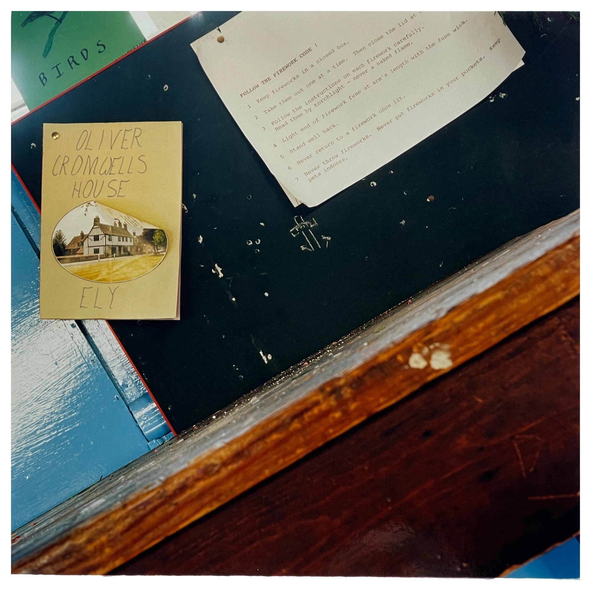 Photograph by Richard Heeps.  A noticeboard in a Scout Hut has a handmade leaflet for Oliver Cromwell's House pinned on it.  This sits alongside an old typed note on the Firework Code.