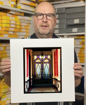 'Foyer VII' shows an Art Deco entrance hall in Milan, featuring stained glass panelling and marble flooring. This artwork is part of Richard Heeps' series 'A Short History of Milan', which began in November 2018 for a special project featuring at the Affordable Art Fair Milan 2019, and the series is ongoing. There is a reoccurring linear, structural theme throughout the series, capturing the Milanese use of materials in design such as glass, metal, wood and stone. 