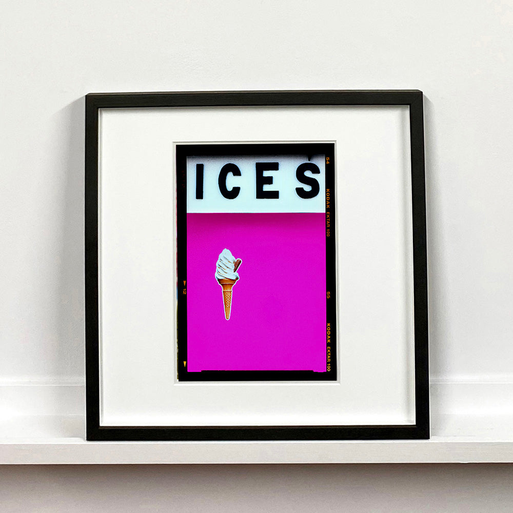 Black framed photograph by Richard Heeps. Pink typography print of an ice cream on pink colour blocking with the Kodak film rebate.