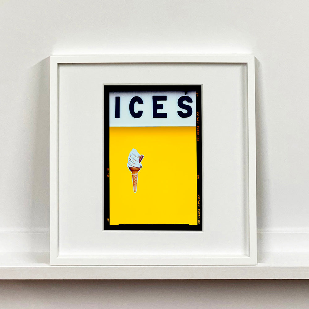White framed photograph by Richard Heeps.  Yellow typography print of an ice cream on a yellow colour block with the Kodak film rebate.