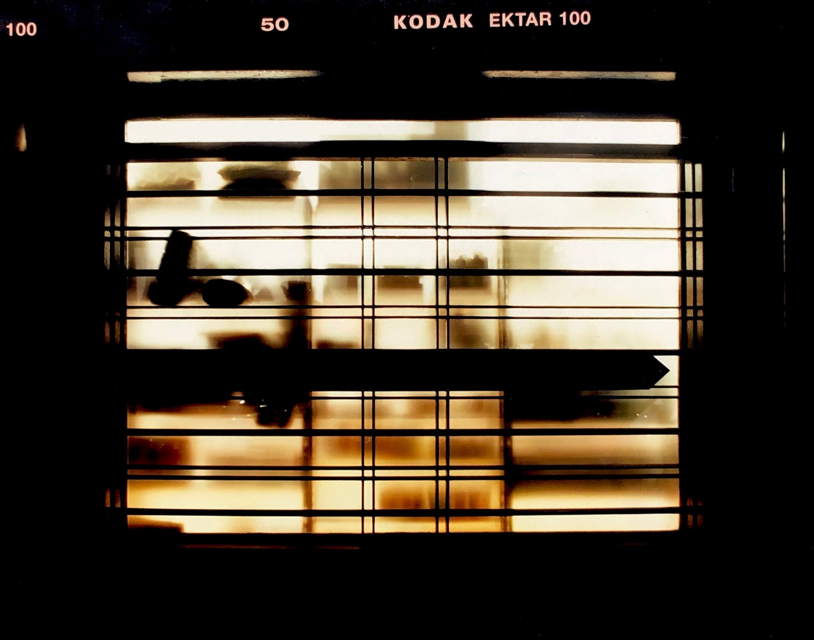 Silhouettes seen through a shop window in Milan. 