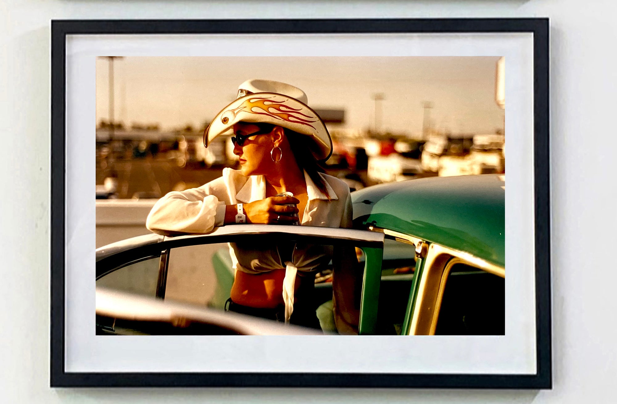 'Sun Kissed Wendy', from Richard Heeps' 'Man's Ruin' Series. This piece is part of a sequence of artworks capturing Wendy at the Rockabilly Weekender, Viva Las Vegas. This cinematic portrait of Wendy captures her kissed by the sunset.