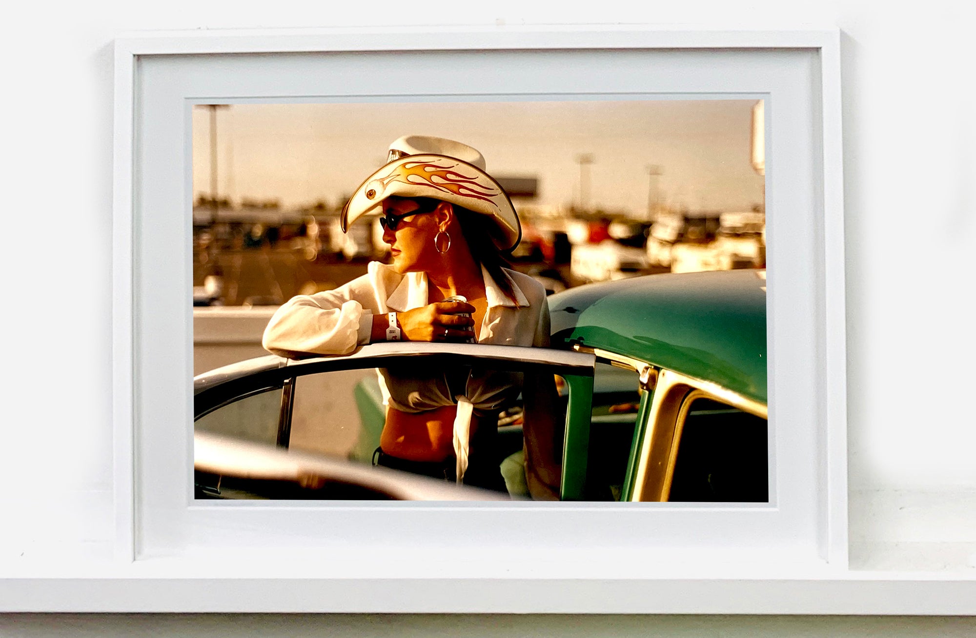 'Sun Kissed Wendy', from Richard Heeps' 'Man's Ruin' Series. This piece is part of a sequence of artworks capturing Wendy at the Rockabilly Weekender, Viva Las Vegas. This cinematic portrait of Wendy captures her kissed by the sunset.