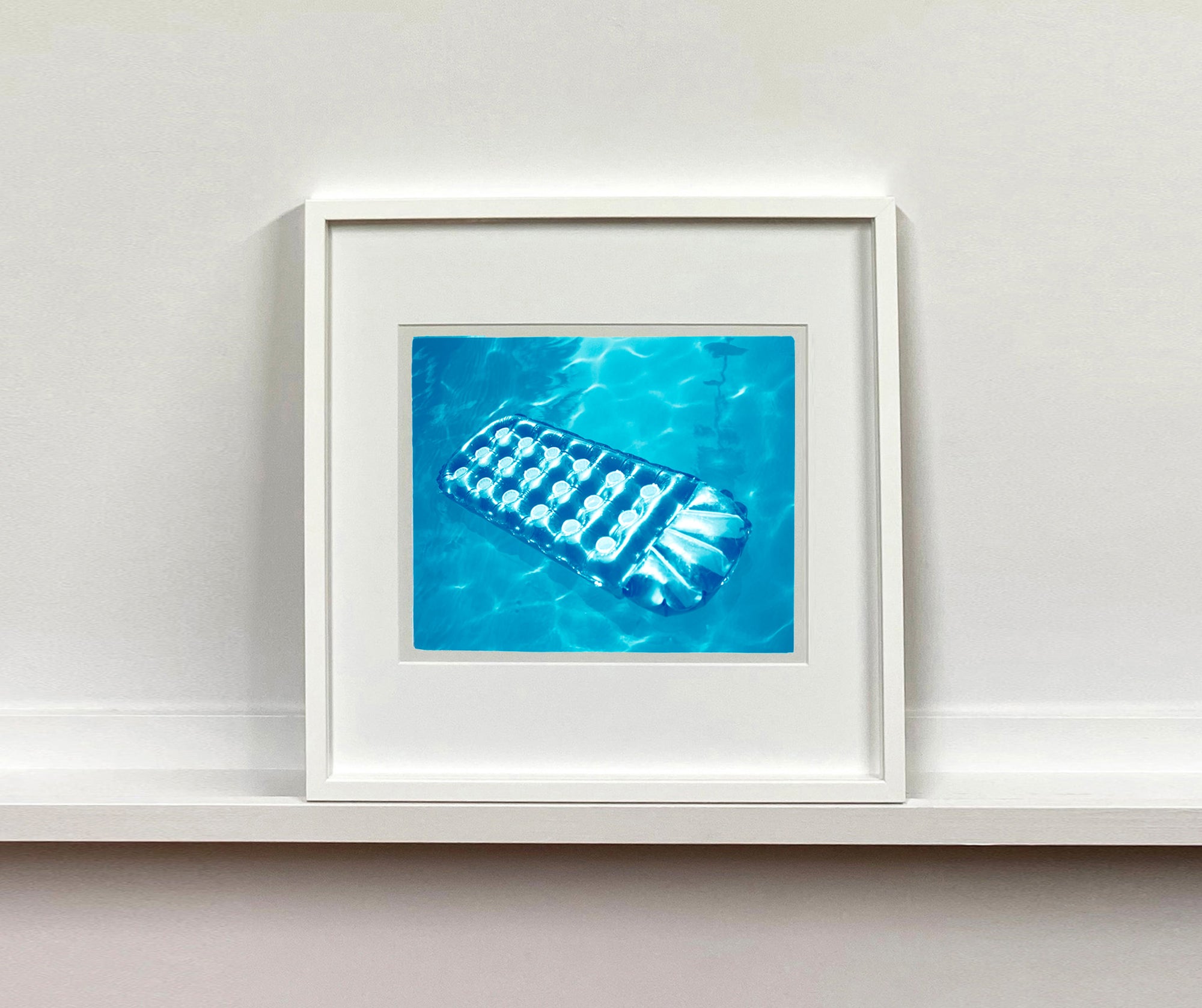 This cooling Palm Springs, California artwork is the perfect way to bring summer vibes into your home all year round. The glistening pool water is idyllic and inviting.  