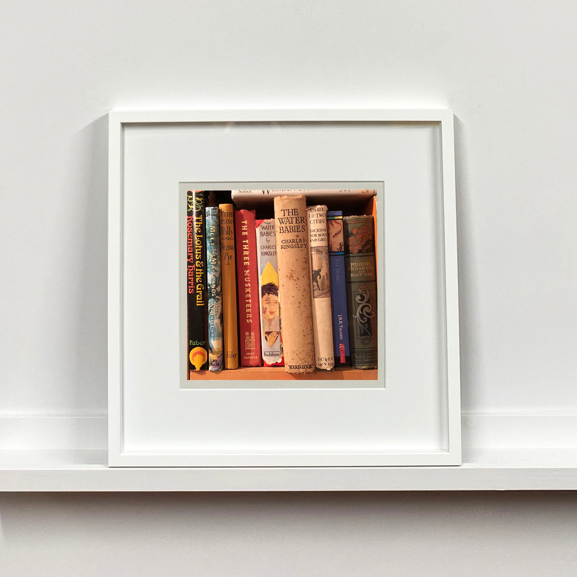 'Water Babies' shows the well worn spines of vintage children's books on a shelf, photographed by Richard Heeps in a secondhand bookshop in the British Seaside town Sheringham.