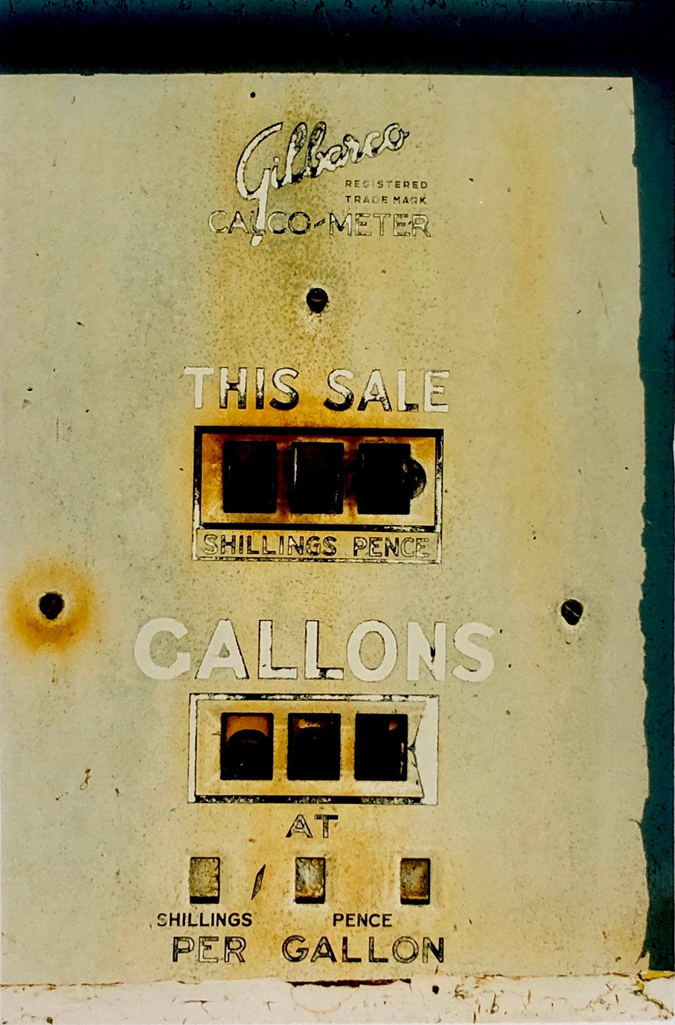 'This Sale' features a vintage petrol pump, something that Richard likes to collect, captured in a Fenland village in the rural area near Richard's home in Cambridge. This artwork is part of his autobiographical series, 'A View of the Fens from the Car with Wings'.
