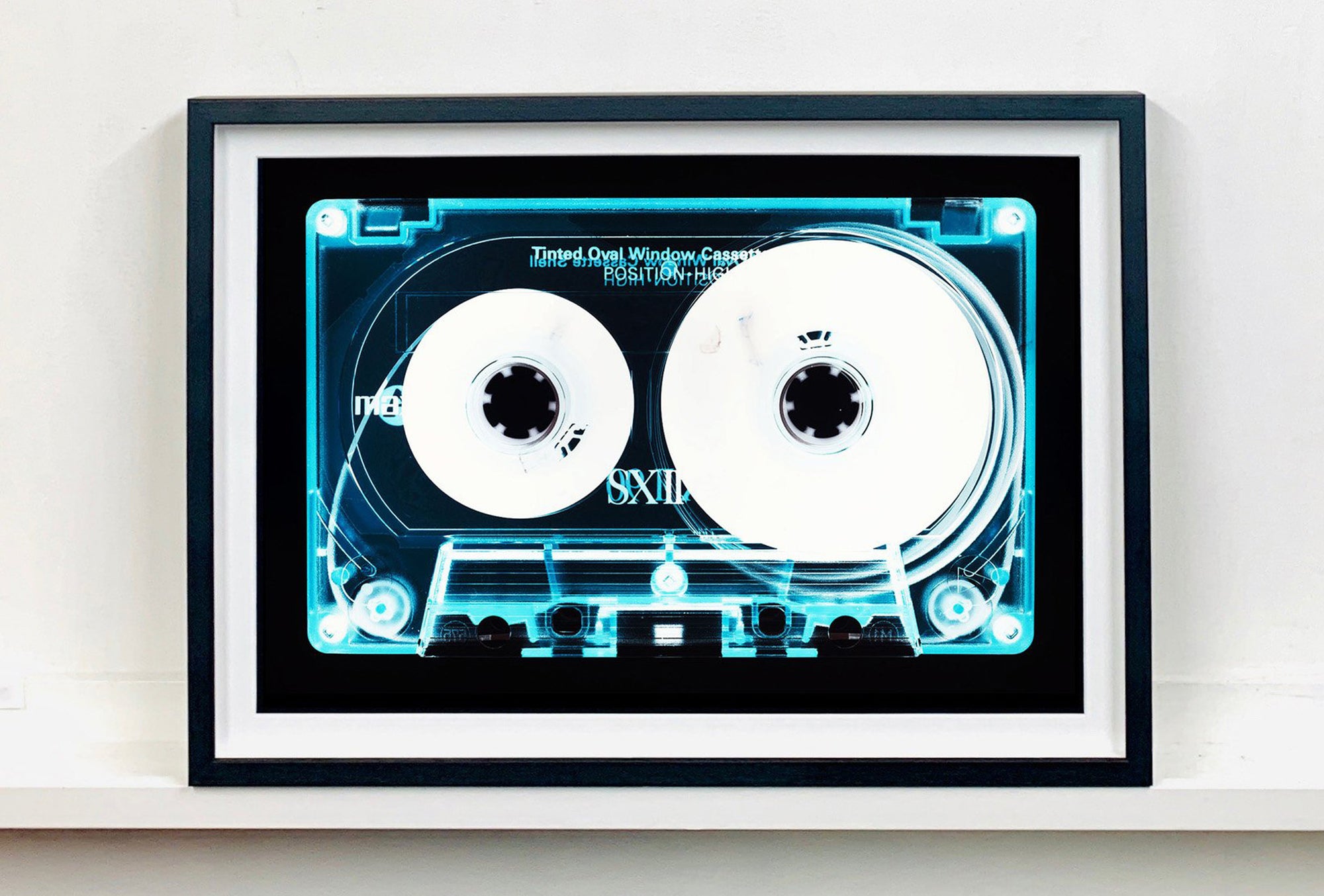 Tape Collection 'Tinted Oval Window Cassette'. The Heidler & Heeps collaborations are creative representations of Natasha Heidler and Richard Heeps’ personal past, and their personalities. Tapes are significant in both their lives and the work here is made from their own collections. Their unique process makes these artworks not inanimate objects, rather they have depth, texture, grit, and they even appear to move.