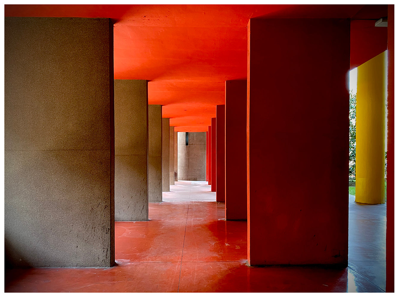 Red and yellow brutalist concrete architecture photograph by Richard Heeps.