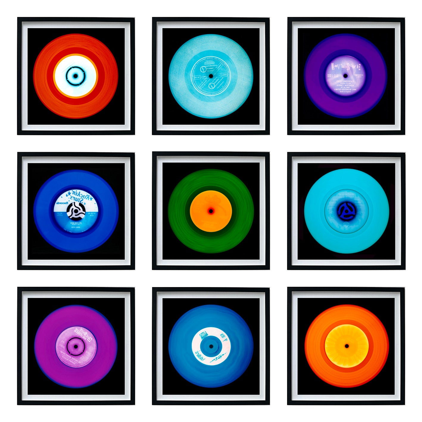Photographs by Natasha Heidler and Richard Heeps.  A set of 9 vinyls records in a variety of colours in a 3 x 3 configuration.