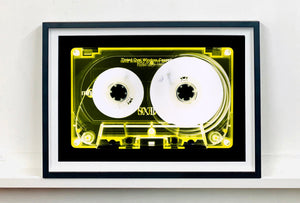 Tape Collection 'Yellow Tinted Cassette'. The Heidler & Heeps collaborations are creative representations of Natasha Heidler and Richard Heeps’ personal past, and their personalities. Tapes are significant in both their lives and the work here is made from their own collections. Their unique process makes these artworks not inanimate objects, rather they have depth, texture, grit, and they even appear to move.